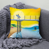 Golden Hour cushion – Saltburn beach huts, pier and surf art by Matt Whaley