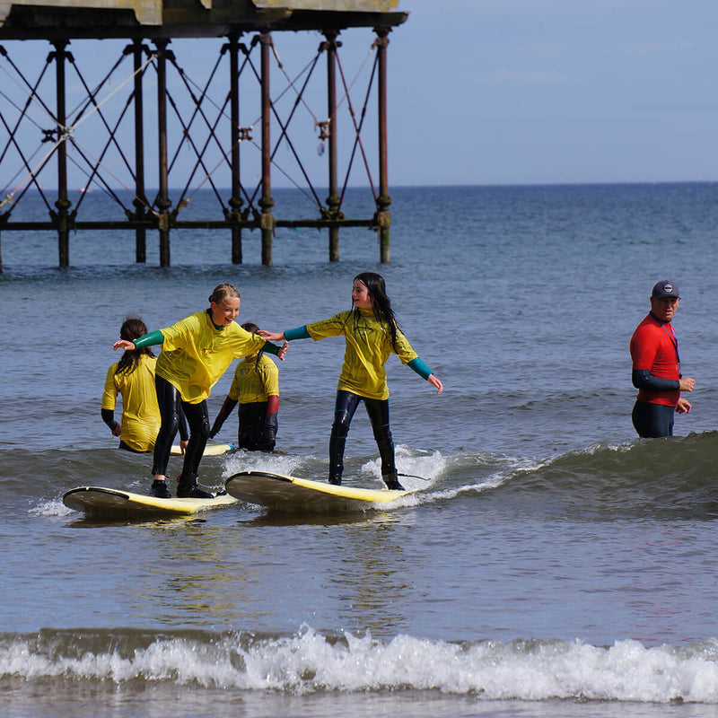 Our daughter and friends learning to surf with Flow Surf School, Saltburn